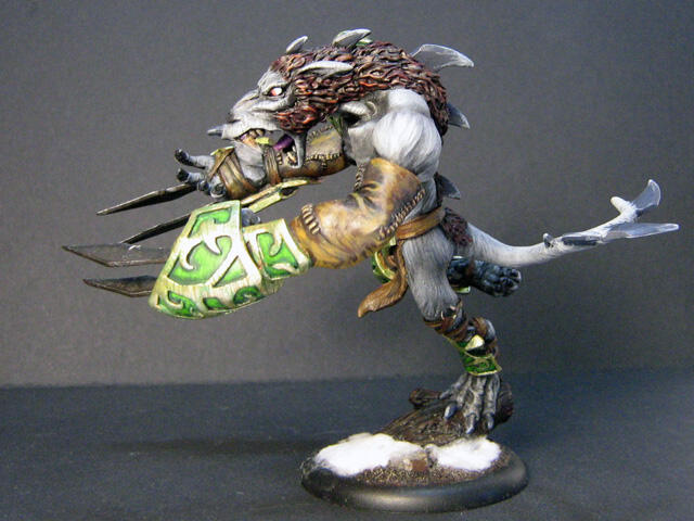 Photo of a painted white rat warrior miniature with shield on a snowy base.